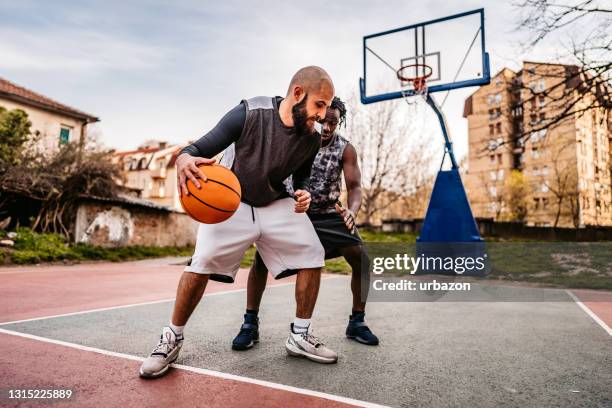 one on one basketball - linebacker stock pictures, royalty-free photos & images