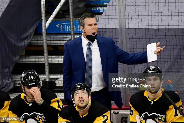 Pittsburgh Penguins head coach Mike Sullivan reacts during a game between the Pittsburgh Penguins and Boston Bruins at PPG PAINTS Arena on April 27,...