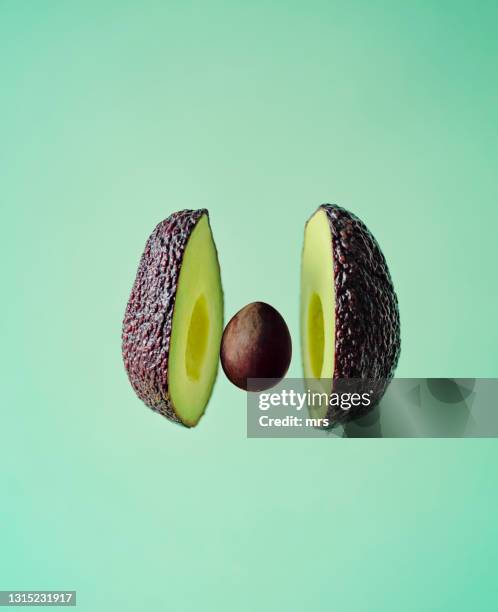 avocado - half and half stock pictures, royalty-free photos & images