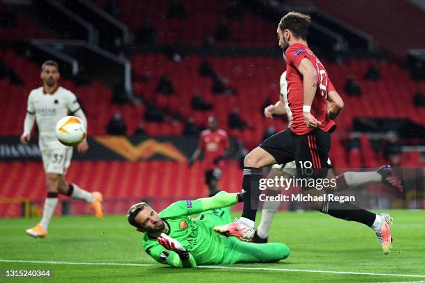 Bruno Fernandes of Manchester United scores their team's first goal past Pau Lopez of Roma during the UEFA Europa League Semi-final First Leg match...