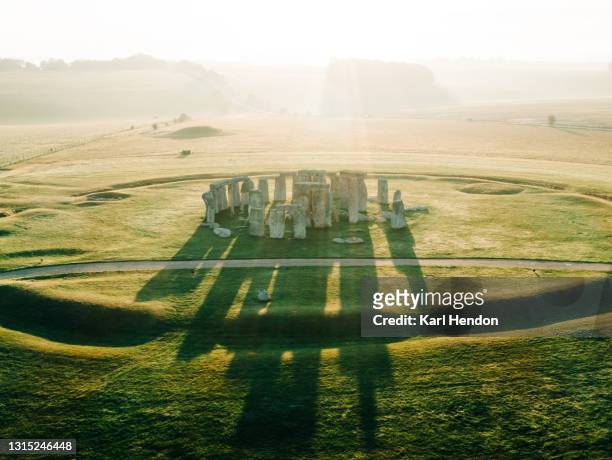 an aerial view of stonehenge at sunrise - stock photo - mythology stock pictures, royalty-free photos & images