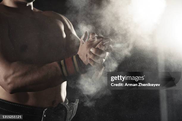 athlete applying chalk powder - sports chalk stock pictures, royalty-free photos & images