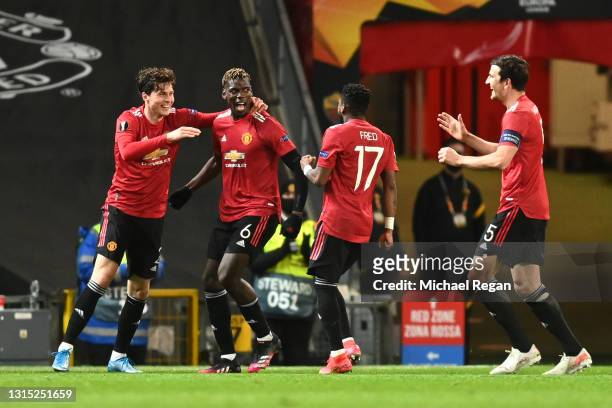 Paul Pogba of Manchester United celebrates with teammates Victor Lindeloef, Fred and Harry Maguire after scoring their team's fifth goal during the...