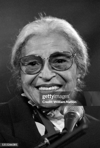 American activist in the civil rights movement best known for her pivotal role in the Montgomery bus boycott Rosa Parks smiles on stage before...