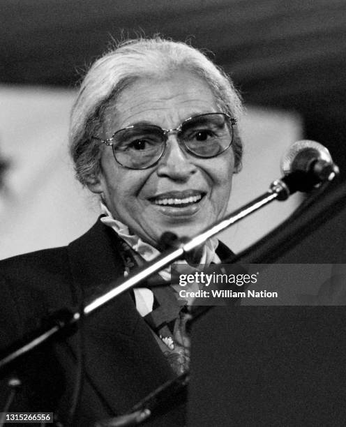 American activist in the civil rights movement best known for her pivotal role in the Montgomery bus boycott Rosa Parks smiles on stage before...