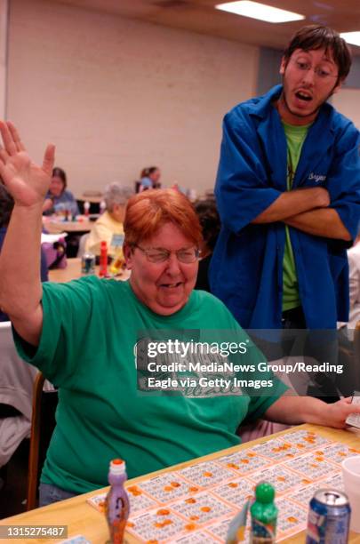 Mary Nagle, Reading, cries out BINGO at Scott's Bingo on 10th and Exeter streets. Bryan S. Miller yells out the numbers to confirm the her win....