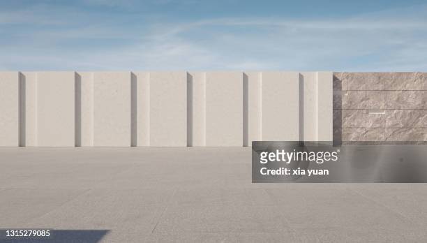 empty square in front of marble and stone wall - immeuble moderne photos et images de collection