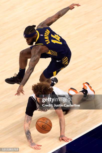 Tyler Johnson of the Brooklyn Nets and JaKarr Sampson of the Indiana Pacers dive for the ball during the third quarter at Bankers Life Fieldhouse on...
