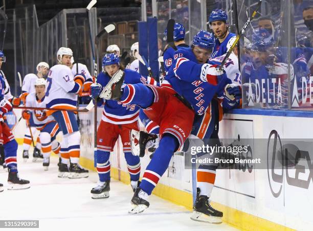 Ryan Lindgren of the New York Rangers is injured as he checks Cal Clutterbuck of the New York Islanders into the glass during the third period at...