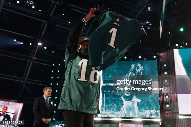 Fan holds a jersey after DeVonta Smith was selected 10th by the Philadelphia Eagles during round one of the 2021 NFL Draft at the Great Lakes Science...