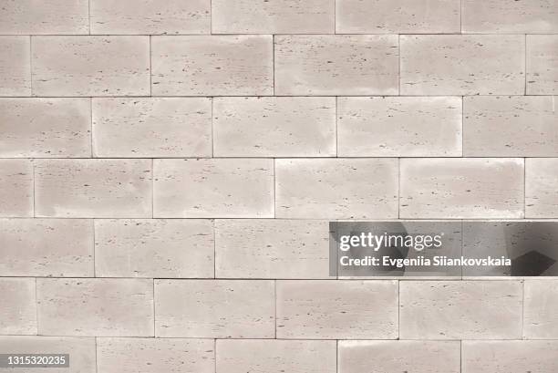 background of beautiful new gray brick wall. - caillou photos et images de collection