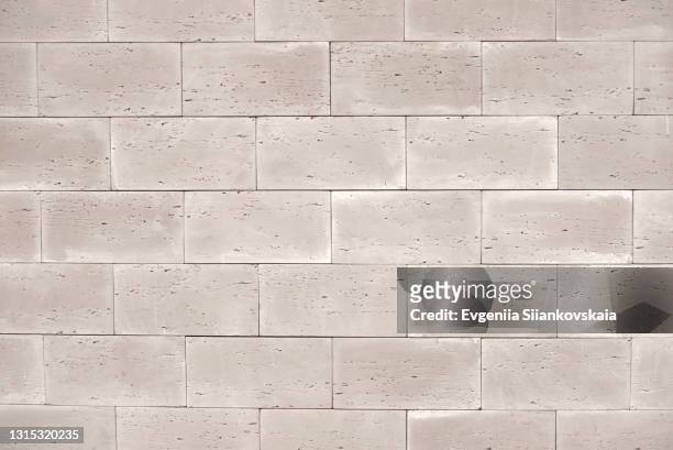 background of beautiful new gray brick wall. - concrete block stock pictures, royalty-free photos & images
