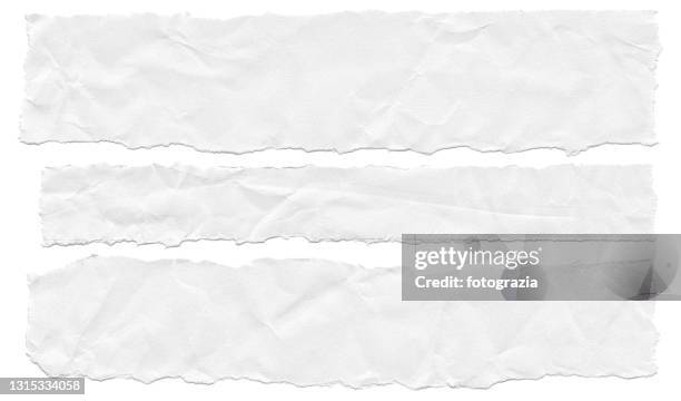 wrinkled torn pieces of paper on white background - tear photos et images de collection