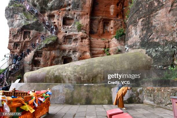 The foot of Leshan Giant Buddha stone statue is pictured on April 28, 2021 in Leshan, Sichuan Province of China.