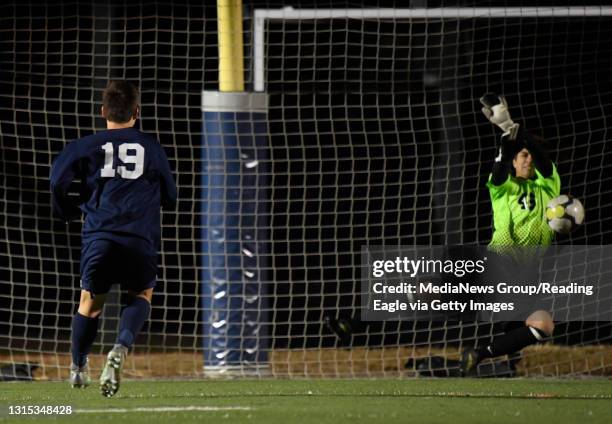 Camp Hill goalie Noah Smeriglio makes a save on Kutztown's Jake Aston to secure the win in penalty kicks.BOYS SOCCER Kutztown Cougars vs Camp Hill...