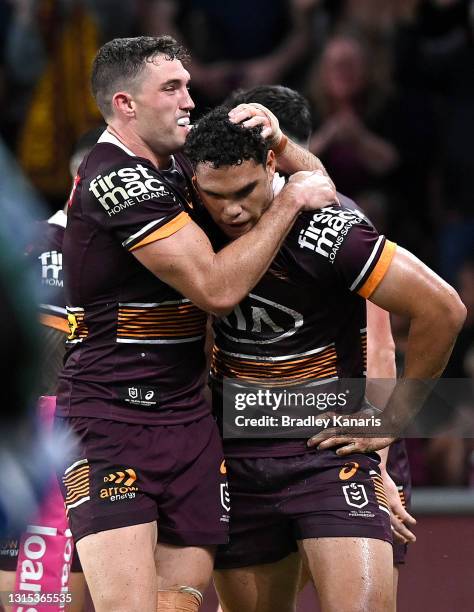 Xavier Coates of the Broncos celebrates with Corey Oates after scoring a try during the round 8 NRL match between the Brisbane Broncos and the Gold...