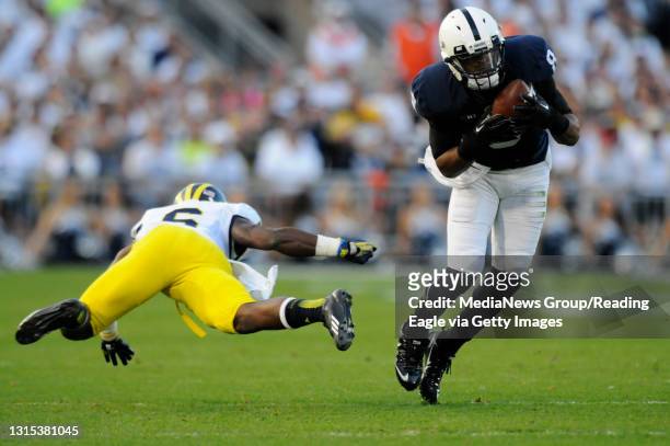 Penn State wide receiver Allen Robinson side steps a diving Michigan defensive back Raymon Taylor .COLLEGE FOOTBALL Penn State Nittany Lions vs...