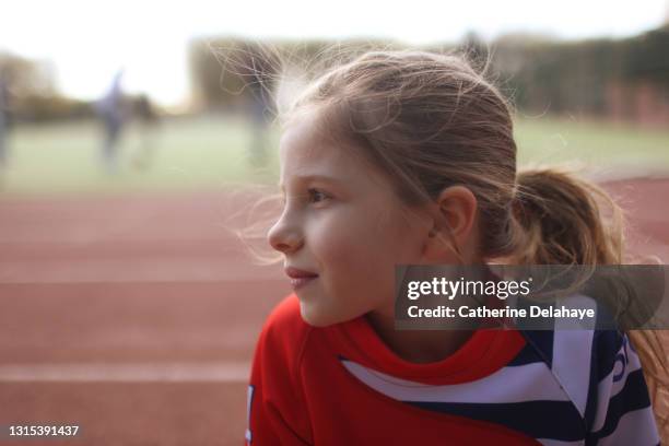 portrait of a young girl on an athletics track - bright future stock pictures, royalty-free photos & images