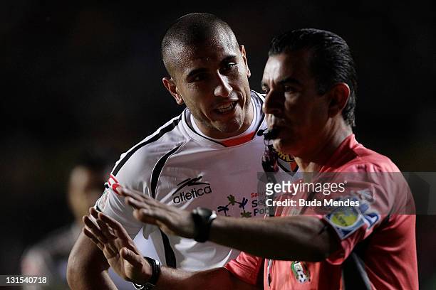 Miguel Martinez of Jaguares reacts with a referee Paul Enrique Haro after a red card during a match between Morelia and Jaguares as part of Serie A...
