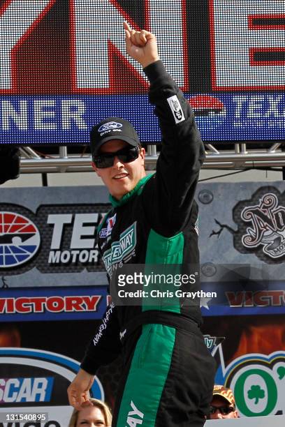 Trevor Bayne, driver of the RickyVsTrevor.com Ford, celebrates with his crew in victory lane after he won the NASCAR Nationwide Series O'Reilly Auto...