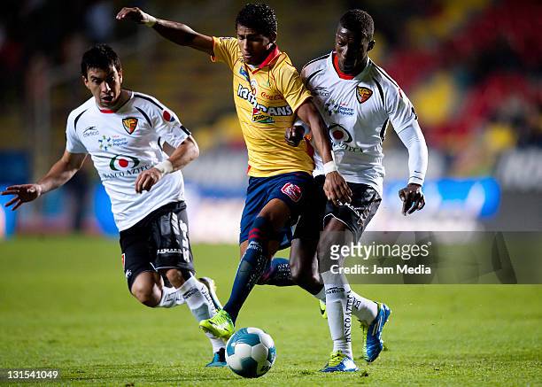 Joao Rojas of Morelia struggles for the ball with Franco Arizala of Jaguares during a match between Morelia and Jaguares as part of the Apertura 2011...