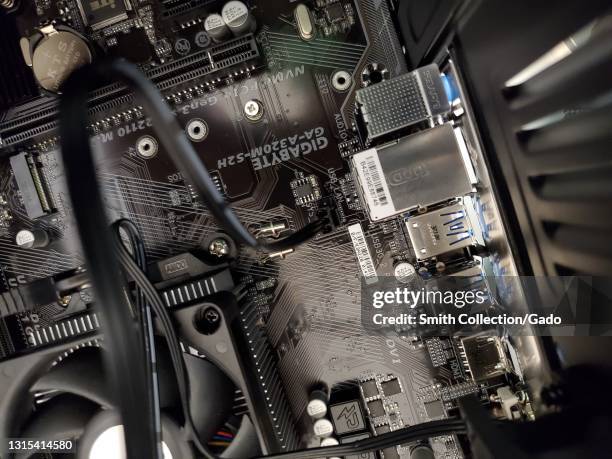 High-angle view of the inside of a desktop PC case with a Gigabyte motherboard visible in Lafayette, California, March 16, 2021.