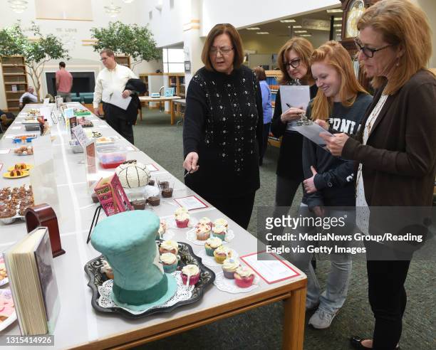 Edible Book Festival at Alvernia. Judging the entries L to R Helen Flynn, wife of the president, Christine Quinter, staff, Emily Foster, student, and...