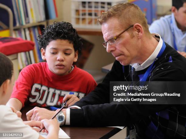 Teacher Leo Hanley works with Hector Marcano originally from Puerto Rico, and another student.English as a Second Languag allows students to study...