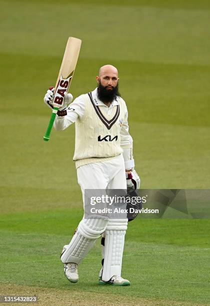 Hashim Amla of Surrey celebrates reaching his double century during Day Two of the LV= Insurance County Championship match between Surrey and...