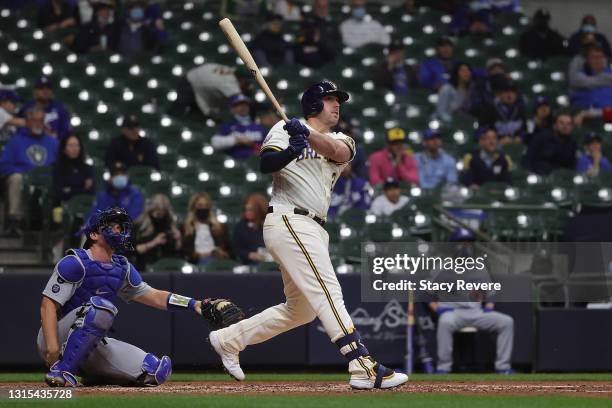 Travis Shaw of the Milwaukee Brewers hits a two run home run against the Los Angeles Dodgers at American Family Field on April 29, 2021 in Milwaukee,...