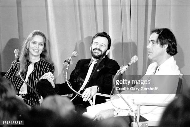 View of, from left, American actress Barbara Bach, British musician Ringo Starr, and comedian Robert Klein, during the recording of an episode of the...
