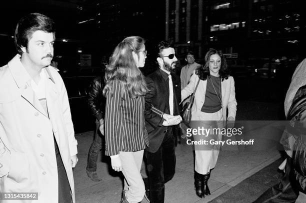 View of couple, American actress Barbara Bach and British musician Ringo Starr hold hands as they arrive for a taping of the Robert Klein Radio Hour...