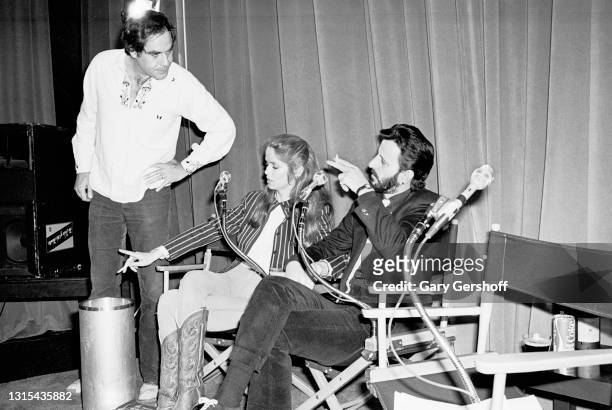 View of, from left, comedian Robert Klein, American actress Barbara Bach, and British musician Ringo Starr during a pause in the recording of the...