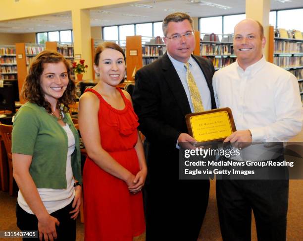 Photo by Tim Leedy 7/20/12Exeter Community Library presents a plaque to J.P. Mascaro & Sons for their recent donations to the library.L to R Lindsay...