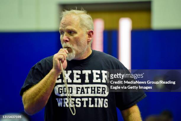 Exeter Mat Club president Mike Hodowanec coaches inside a new elementary wrestling room located at Lausch Elementary School on Tuesday, October 23,...