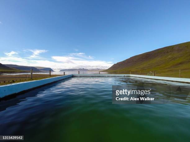 thermal swimming pool in iceland's westfjords - westfjords iceland stock pictures, royalty-free photos & images
