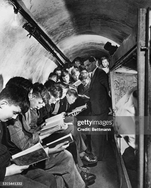 Many schools in England went underground during the war. Here is one such schoolroom during a class session. Nurseries and hospitals took to the...