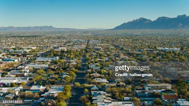 aerial view of urban sprawl spilling out of tucson, arizona - establishing shot stock pictures, royalty-free photos & images