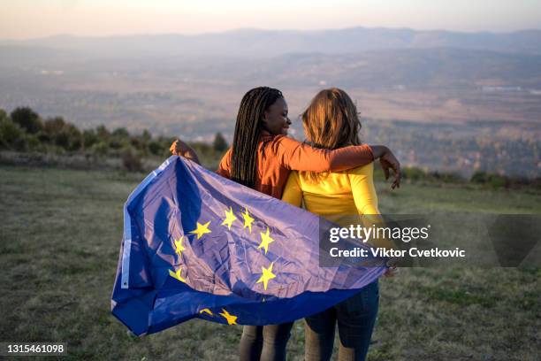 diverse group of women with eu flag - serbia eu stock pictures, royalty-free photos & images