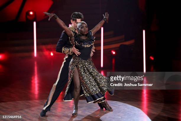 Auma Obama and Andrzej Cibis perform on stage during the 8th show of the 14th season of the television competition "Let's Dance" on April 30, 2021 in...