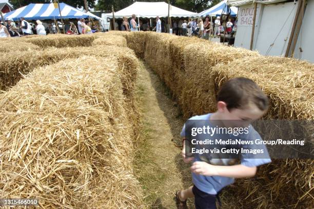 Lauren A. LittleJuly 2, 2006Kutztown Folk FestivalStephen T. Caldwell of Coopersburg,Lehigh County, races through the hay bale maze Sunday at the...