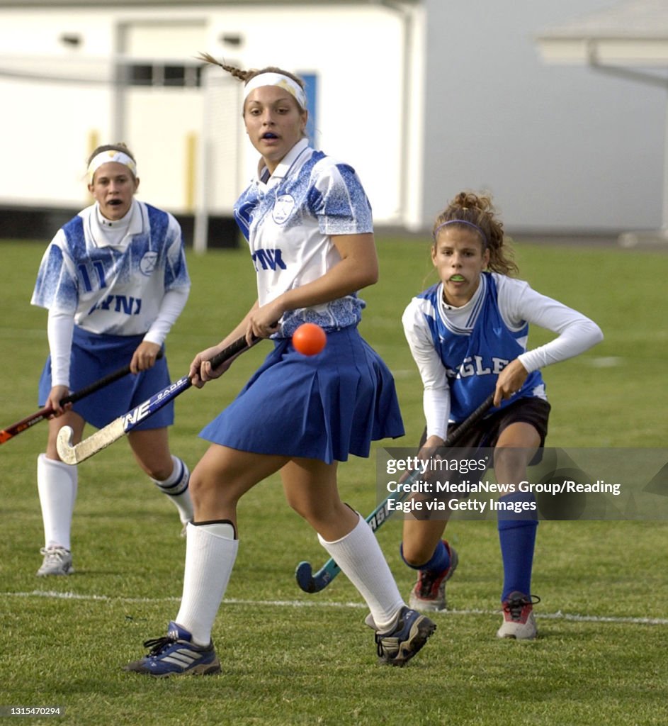 L-R Oley's #11 Courtney Fretz and #16 Lauren Chubb watch the ball along with Exeter's #32 Katie Pufnock at today's quarterfinal game at Conrad Weiser.200402919Susan L. Angstadt10-18-04