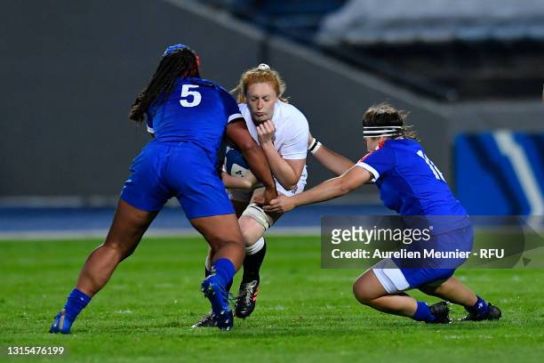 Harriet Millar-Mills of England is tackled by Safi N'Diaye of France during the Women's International Friendly match between France and England at...