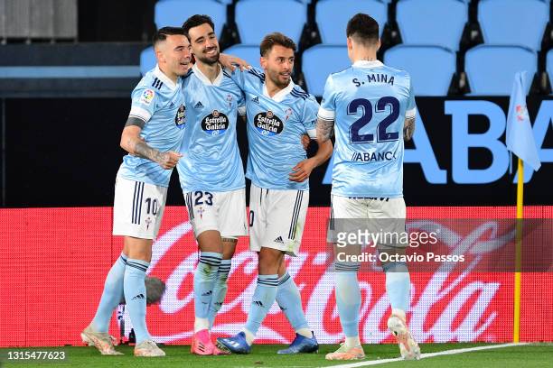 Brais Mendez of Celta Vigo celebrates with team mates Iago Aspas, Kevin Vazquez and Santi Mina after scoring his team's first goal during the La Liga...