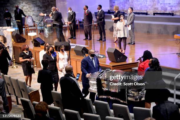 Family members walk behind the remains of 16-year-old Ma'Khia Bryant following her funeral service at First Church of God on April 30, 2021 in...