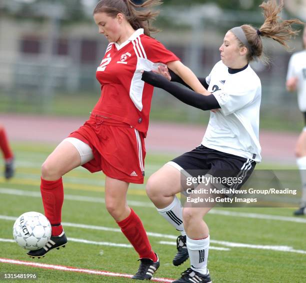 Photo by Krissy Krummenacker 200800727 Fleetwood's Jackie Buss battles to keep the ball from Lancaster Mennonite's Joanna Cotee Tuesday, May 20 in...