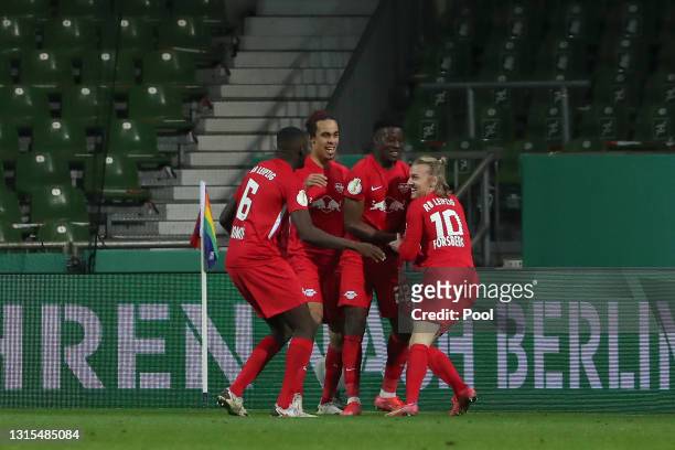 Emil Forsberg of RB Leipzig celebrates with team mates Nordi Mukiele, Yussuf Poulsen and Ibrahima Konate after scoring his team's second goal during...