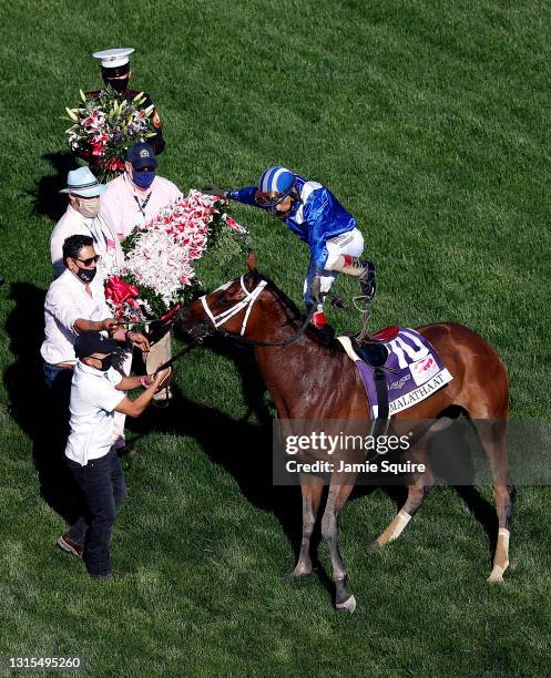 Jockey John Velazquez is thrown from Malathaat after winning the 147th Running of the Kentucky Oaks at Churchill Downs on April 30, 2021 in...