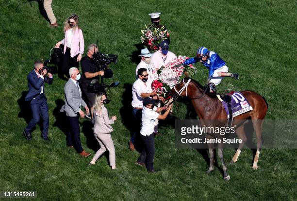 Jockey John Velazquez is thrown from Malathaat after winning the 147th Running of the Kentucky Oaks at Churchill Downs on April 30, 2021 in...