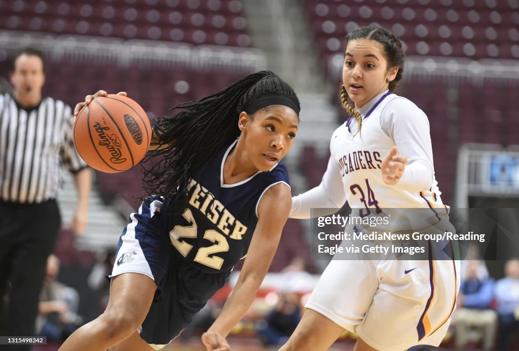 Conrad Weiser vs. Lancaster Catholic GBASK  Weiser's Ta Cari Talford drives to the basket against Lancaster Catholic's Corina Rivera. &#10;&#10;Photo by Susan L. Angstadt &#10;2/24/2016